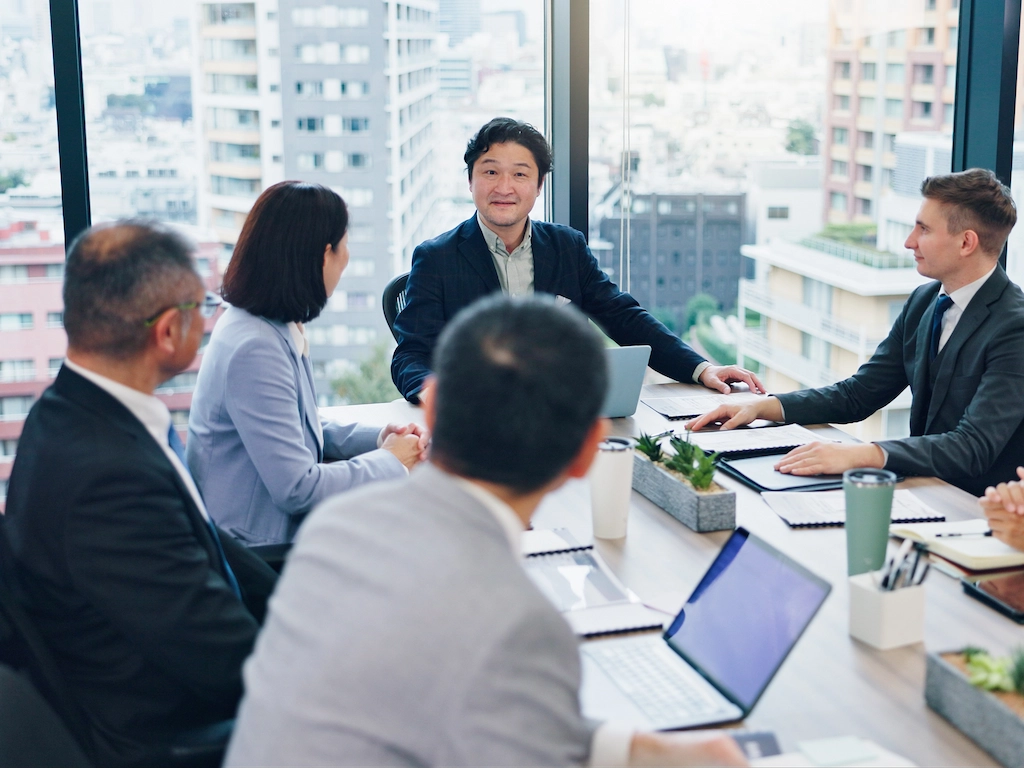 Employees discussing finance during a coworking office meeting