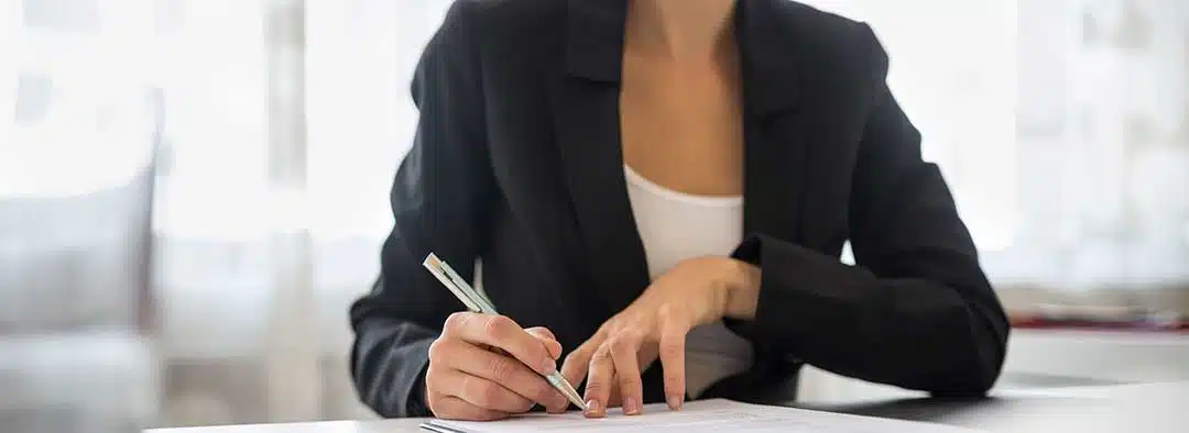 A lady filling out a petition
