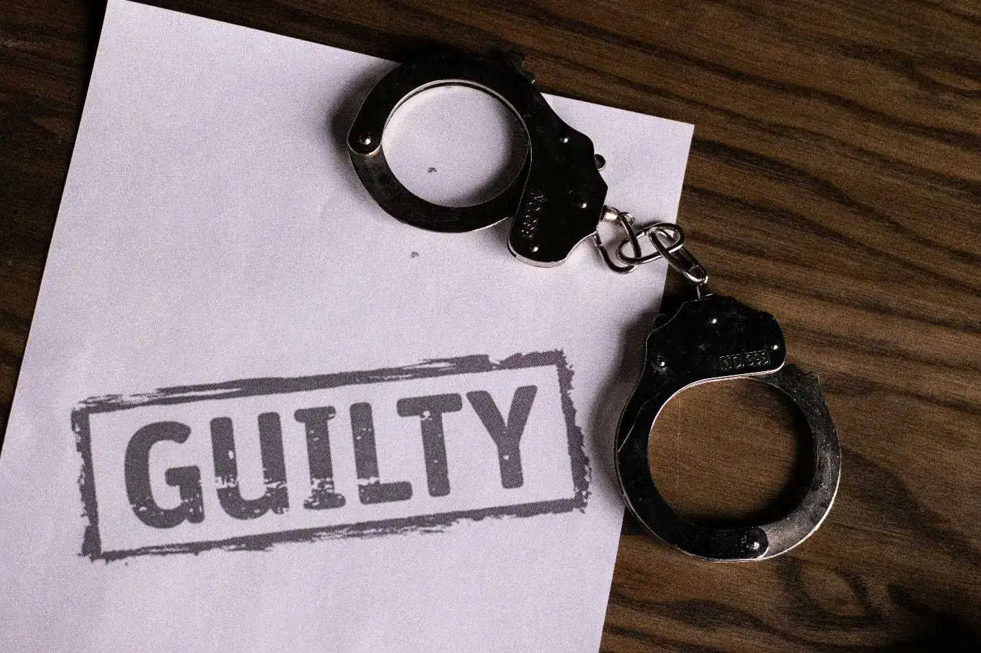 Parental Kidnapping in the Philippines - handcuffs over a paper with text guilty 6