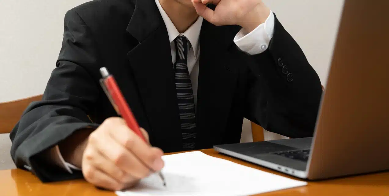 A photo of a lawyer in a black suit attending a videoconference for an Annulment in the Philippines without appearance