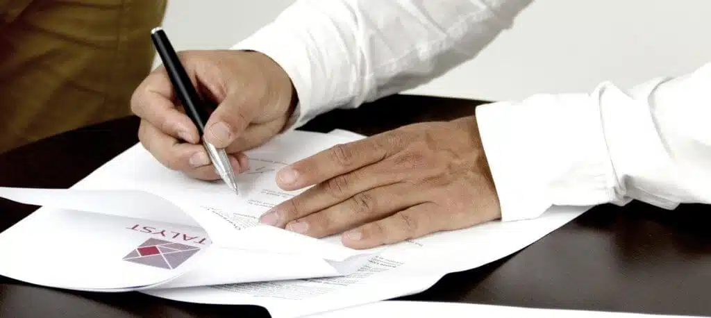 A man signing corporate documents to incorporate in the Philippines