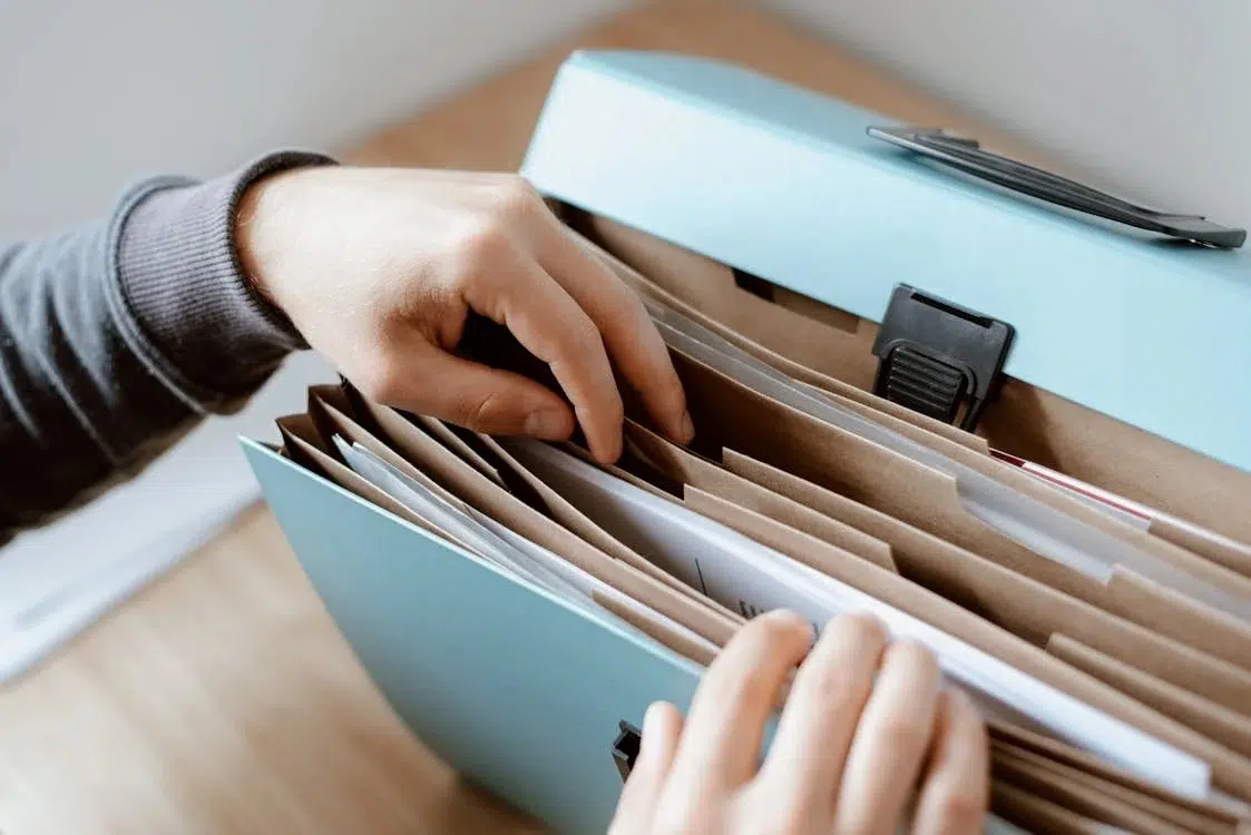 A person looking for a document in his case folder