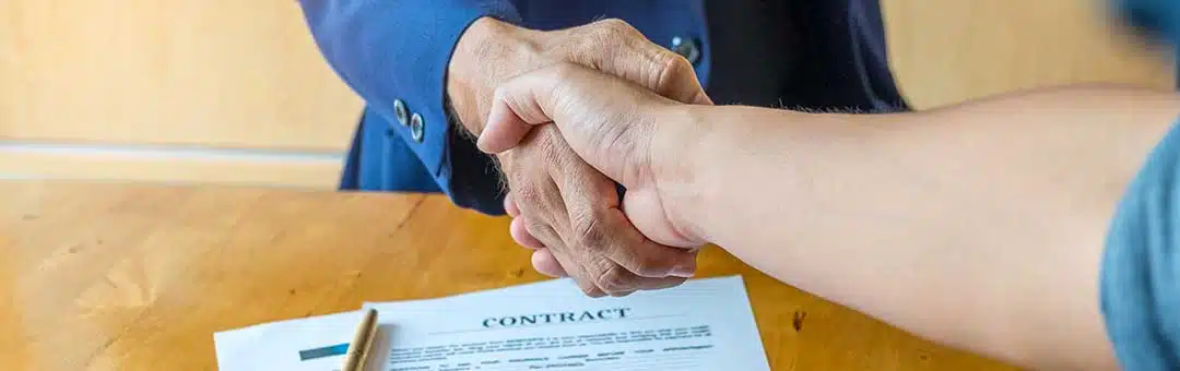 Shake hands and a mortgage  contract