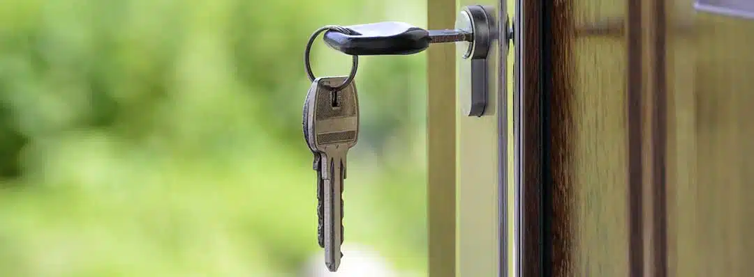 Key in keyhole opening the door